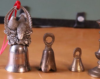 Vintage group of miniature bells and candle stick
