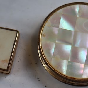 Vintage set of powder puff compacts Large one is a Cream Puff made in USA the other is no name.