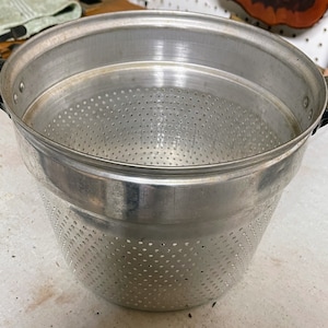 Vintage aluminum strainer 9 by 7 inches