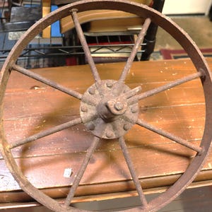 Vintage 16 inch iron spoke wheel with brackets