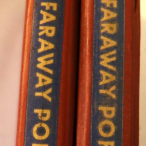 May include: Two red hardcover books with gold lettering on the spines. The spines read "Faraway Ports" in gold letters on a blue background.