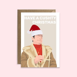 May include: Greeting card with a cartoon illustration of a man wearing a Santa hat, a red turtleneck, and a tan coat. The text "HAVE A CUSHTY CHRISTMAS" is printed at the top of the card. The card is inside a brown envelope.