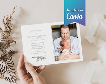 May include: A rectangular memorial service announcement card featuring a photograph of a person holding a newborn baby. The text reads In Loving Memory, Camden Andrew Petersen, and includes service details and a floral graphic at the bottom.