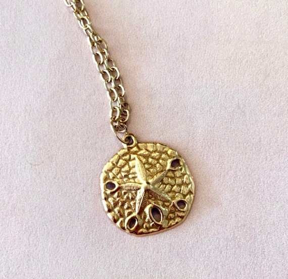 Sand dollar minimalist solid 14k gold pendant.