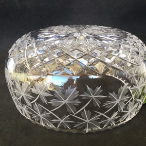 May include: A clear glass bowl with a cut glass design and etched leaf pattern.