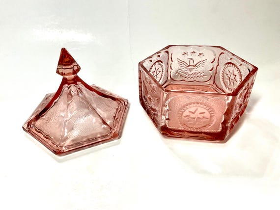 Pink glass trinket dish with the American Bald Eagle design