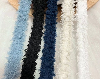 May include: Four different colors of fuzzy trim, including light blue, black, dark blue, and white.