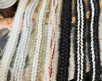 May include: Assortment of braided trim with sparkly fringe in various colors, including white, gold, red, black, and white and black. The trim is perfect for adding a touch of sparkle to crafts, clothing, and home decor.