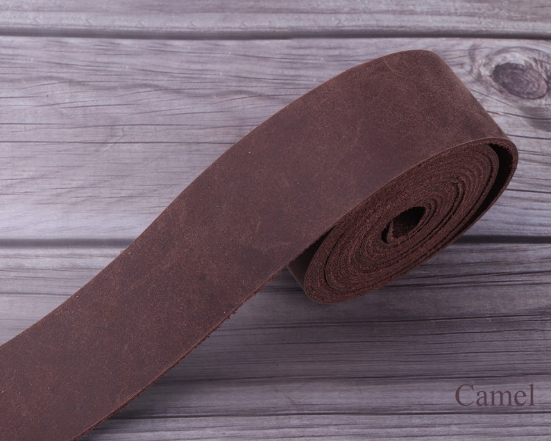 May include: A roll of brown leather strap, perfect for crafting projects. The leather is soft and supple, and the strap is a great choice for making belts, bags, or other leather goods.