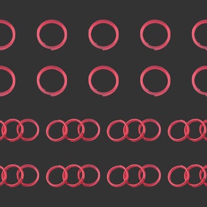 May include: A set of 20 red metal rings, some are single rings and some are sets of three rings linked together.