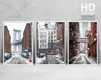 May include: A triptych of framed prints depicting snowy cityscapes. The prints showcase urban scenes with brick buildings, streets, and a bridge. The text "HD 300dpi INSTANT DOWNLOAD" is visible. The bottom of the prints display the text "© DOLOMART PRINTS \ ETSY STORE".