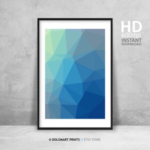 May include: Framed abstract geometric art print featuring a low-poly design in shades of blue and green. The artwork is displayed in a black frame against a gray wall. Text on the right side reads "HD 600dpi INSTANT DOWNLOAD".
