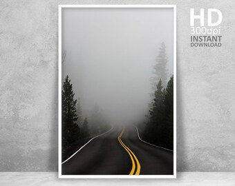 May include: A framed print featuring a winding road disappearing into a foggy forest. The black asphalt road has yellow and white lane markings. The print includes the text "HD 300dpi INSTANT DOWNLOAD" and the Etsy store name.