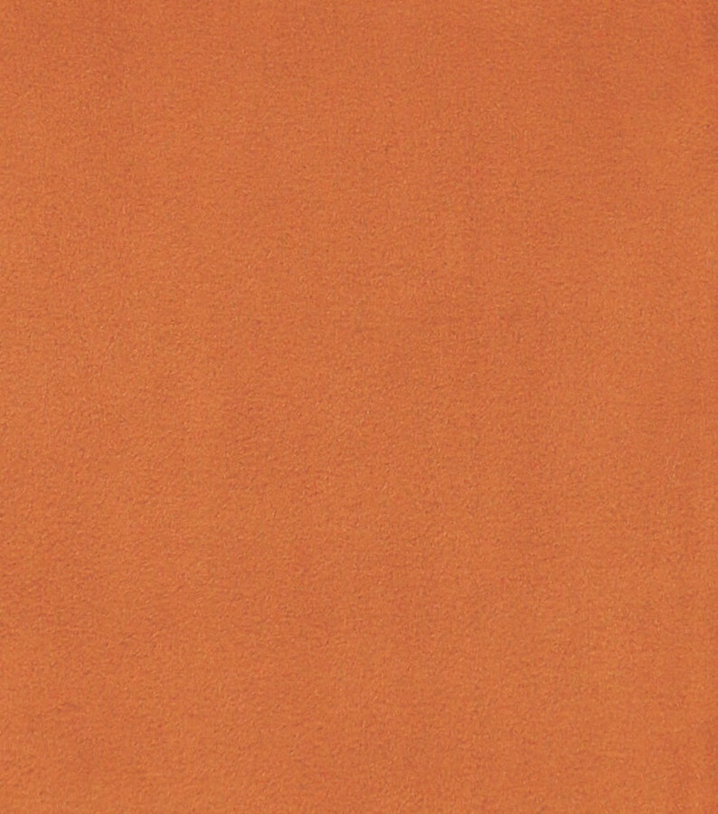 May include: A solid orange fabric with a slightly textured surface.