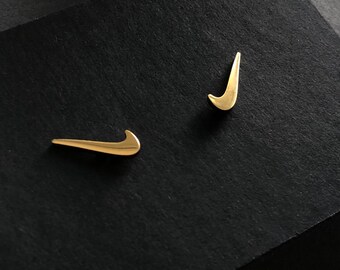 nike gold studs