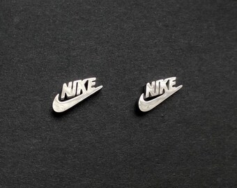 nike gold studs
