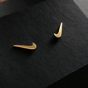 nike supreme earrings