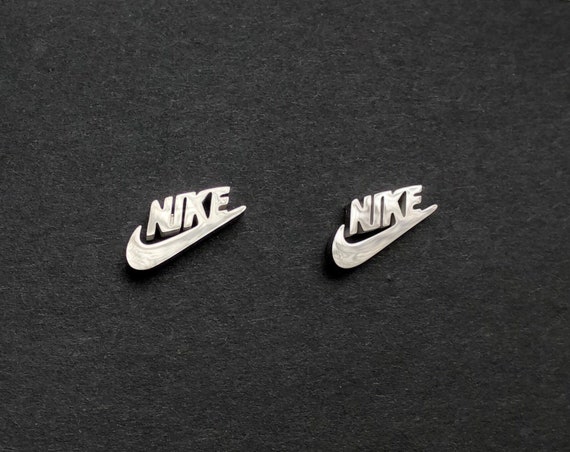 silver nike logo