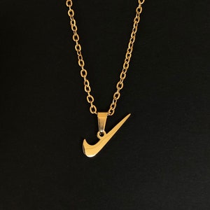nike swoosh gold
