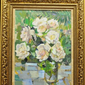 May include: A framed oil painting of a bouquet of white roses in a glass vase. The roses are painted in a loose, impressionistic style with visible brushstrokes. The background is a blurred green and blue.