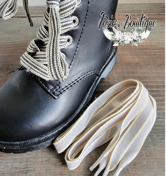 Black boots top white shoelaces