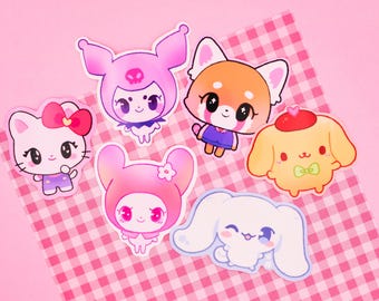May include: Five colorful cartoon character stickers on a pink and white checkered background. The stickers feature a pink bunny with a skull, a red panda wearing a blue shirt, a yellow puppy wearing a red hat, a pink bunny with a flower, and a white bunny with long ears.