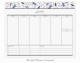May include: A weekly planner notepad with a floral design border. The notepad has a section for each day of the week, a to-do list, and a notes section. The text "THIS WEEK" and "WEEK OF:" is at the top of the notepad.