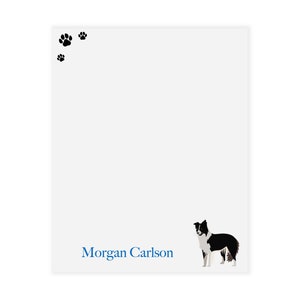 May include: White notepad with a black and white border collie illustration and the text "Morgan Carlson" in blue.