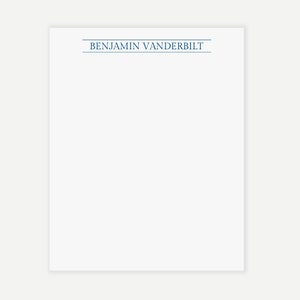 Może przedstawiać: Biała kartka papieru z nadrukowanym na górze niebieskim kolorem imieniem "BENJAMIN VANDERBILT".