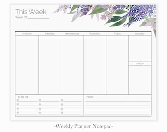 May include: A weekly planner notepad with a floral design at the top. The notepad has a section for each day of the week, a to-do list, and a notes section. The text "This Week" and "Week Of" are at the top of the notepad.