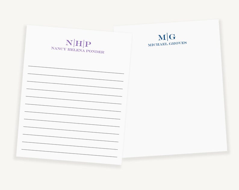 May include: Two white lined notepads with personalized monograms. The top notepad has the monogram "N|H|P" and the text "NANCY HELENA PONDER". The bottom notepad has the monogram "M|G" and the text "MICHAEL GROVES".