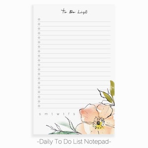 May include: A white notepad with a floral design on the right side. The notepad has a to-do list heading and a section for days of the week. The text "Daily To Do List Notepad" is at the bottom of the notepad.