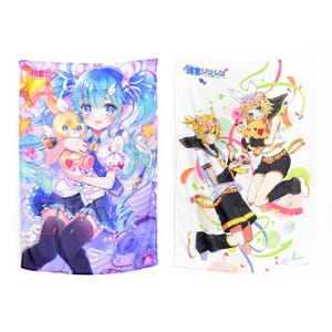 May include: Two colorful anime-style wall scrolls featuring characters from the Vocaloid series. The left scroll features Hatsune Miku holding a yellow plush toy. The right scroll features Kagamine Rin and Len holding a yellow plush toy. Both scrolls have a white background with colorful confetti and ribbons.