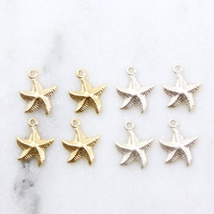 May include: Eight gold and silver starfish charms with a loop for attaching to jewellery or other crafts.