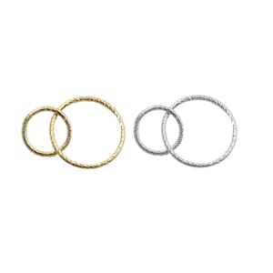 May include: Two interlocking rings, one gold-toned and one silver-toned, each with a textured, rope-like pattern. The rings are set against a white background, showcasing their intertwined design.