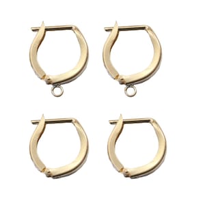 May include: Four gold-colored hoop earrings with a hinged closure and a small loop at the bottom for attaching charms or other embellishments. The earrings are displayed against a white background.