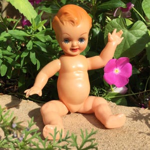 Vintage Blinking Celluloid Doll. Articulated Arms and Legs. Wide Blue Eyes. Pretty Painted Face & Lashes. Kiss Curl. 1950s Collectible Toy.