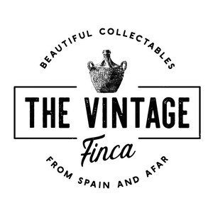 May include: Black and white logo for "The Vintage Finca" with the text "Beautiful Collectables from Spain and Afar" surrounding a drawing of a vintage wine bottle.