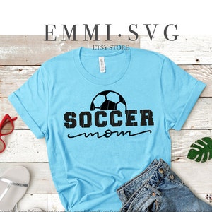 May include: Digital download of a black and white graphic design featuring a soccer ball and the text "SOCCER mom".