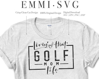 May include: A white t-shirt with a black graphic design that says "Livin' that- GOLF MOM Life". The design is in a square frame with a golf club icon.
