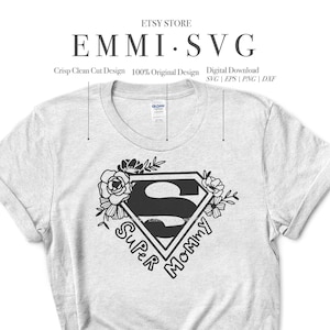 May include: A white t-shirt with a black graphic design of a superhero symbol with the words "Super Mommy" inside. The graphic is surrounded by floral elements.
