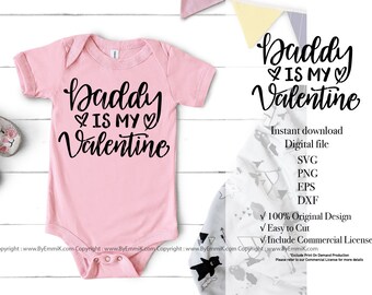 May include: Pink baby onesie with black text that reads "Daddy is my Valentine".