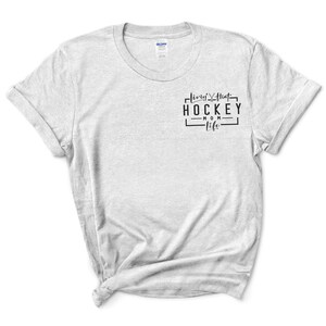 May include: A gray t-shirt with the text "living that hockey mom life" printed on the front.