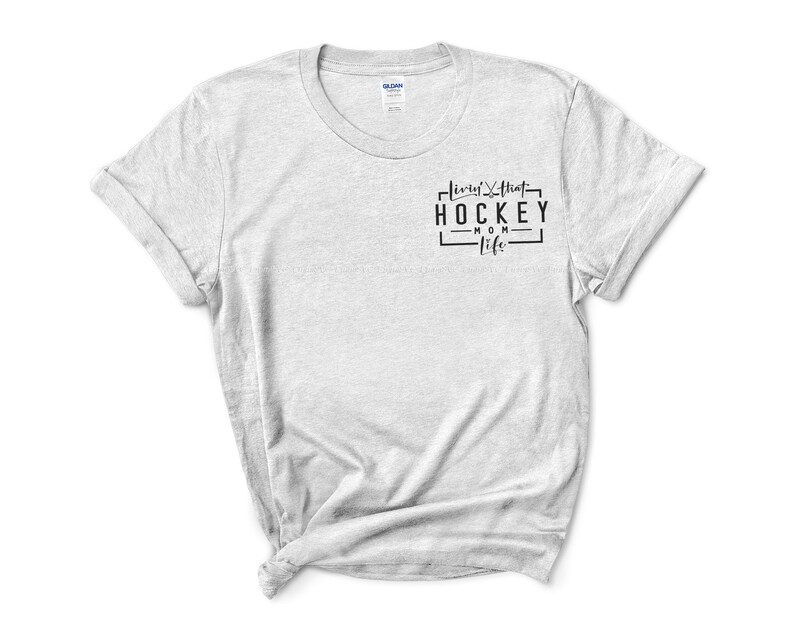 May include: A gray t-shirt with the text "living that hockey mom life" printed on the front.