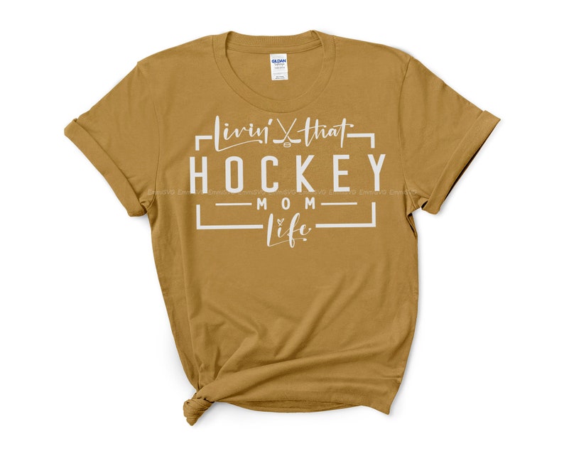 May include: A mustard yellow t-shirt with white text that reads "Livin' that Hockey Mom Life".