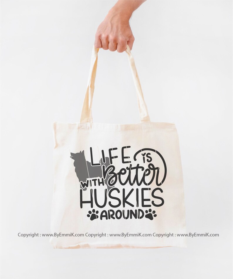 May include: A white canvas tote bag with black text that reads "Life is better with Huskies around" and a paw print graphic.