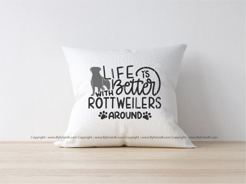 May include: White throw pillow with the text "Life is better with Rottweilers around" and a silhouette of a Rottweiler dog.