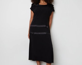 Vintage black crepe dress with satin trim around square neckline and skirt