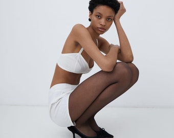 Antique vintage undergarments set featuring sculpted bra and matching pair or high waisted shorts
