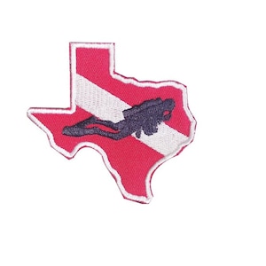 May include: An embroidered patch in the shape of the state of Texas with a scuba diver silhouette and a red and white scuba flag design.
